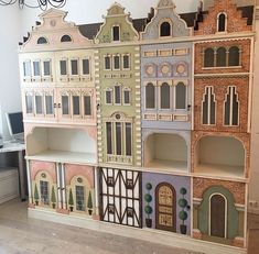 the doll house is made out of cardboard