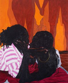 two black women sitting on a bed with their backs to each other