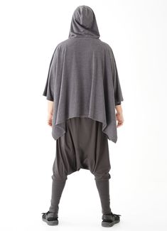 "🚚..ALL ORDERS ARE SHIPPED VIA DHL EXPRESS MAIL Dreamy, poncho style layer. Oversized and effortless, with a hoodie. Features a front pockets and button closures at front and side. Continue to enjoy perfect outdoor days after the temperature turns a little chilly. * Hooded; Button closure * Open sides with button closure * Two front pockets * Oversize, cozy silhouette * Unlined Measurements approximately: Sleeve Length (from side of neckline): 23\" (58 cm) Bust: 48\" (122 cm- all around) Approx Casual Winter Cape With Batwing Sleeves, Casual Cape Poncho For Layering, Casual Layering Poncho Cape, Oversized Cape Poncho For Outdoor, Casual Layering Cape Poncho, Casual Oversized Hooded Poncho, Oversized Winter Cape Top, Oversized Hooded Casual Poncho, Black Hooded Poncho For Outdoor