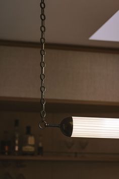 a light fixture hanging from a ceiling in a kitchen with no one inside or outside