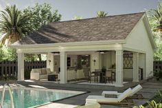 a pool house with a covered patio and lounge chairs next to the swimming pool is surrounded by palm trees