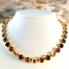 Swarovski Crystal Autumn Fall Colors: Red, Orange, Yellows In Gold Necklace Listing Is For A Necklace In Gold Base Material. Crystals Are Genuine Swarovski Stones. Necklace Includes Fall Colors: Orange, Yellow, Red, Gold, So On. Necklace Measures 18 Inches. 33 Crystals, 8mm. Does Not Come With Earrings. Crystals Are Made In Austria. The Base Gold Plated Material Is Made In Israel. Brand New. May You Wear This Like The Autumn Goddess You Are! Autumn Goddess, Autumn Necklace, Orange Necklace, Stones Necklace, Colors Orange, Swarovski Stones, Fall Jewelry, Accessories Unique, Autumn Fall