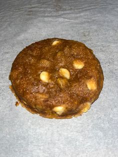 a cookie sitting on top of a piece of wax paper