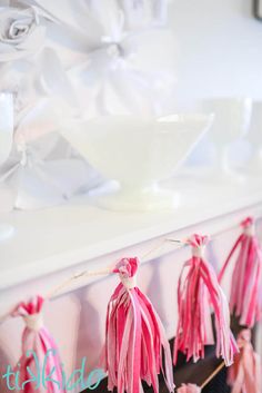 some tassels hanging from a shelf in a room