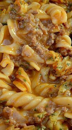 pasta with meat and sauce in a white bowl