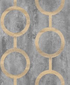 a gray and gold wallpaper with circles on the bottom, in front of a concrete background