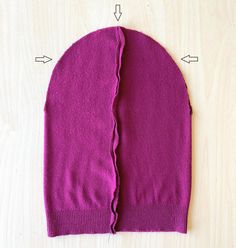 the back side of a purple sweater with measurements for it and how to sew