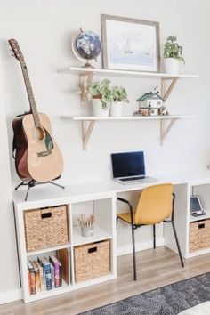 a room that has some shelves and baskets on the wall with a guitar in it