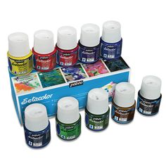 an assortment of different colors of acrylic paint in a display case on a white background