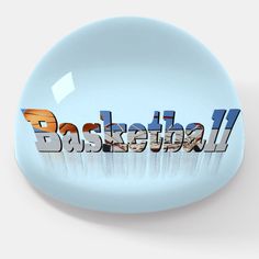 the word basketball written in 3d letters on a blue plate with a white back ground