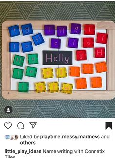 a wooden board with colorful magnets that spell out the words holly and holly on it