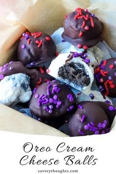 a box filled with oreo cream cheese balls covered in chocolate sprinkles