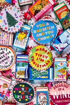 many different types of embroidered badges and magnets