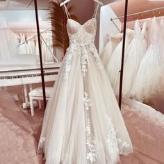 a wedding dress is on display in a store