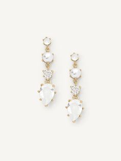 DESCRIPTION The Augustine Drops are for the modern style icon. Warm white gems and a single pearl give these earrings a vintage flare, while their contemporary silhouette is fresh and sleek. Wear with: Alaia Layered Pendant or Basque Cuff DETAILS 1.2" length, 0.4" width 0.29 oz per pair 14K gold plated or silver tone plated Glass crystals, faux pearls, Cubic Zirconia Gem color: Warm white Titanium posts Hypoallergenic and nickel free Olive And Piper, Gold Wedding Earrings, Gold Diamond Drop Earrings, Earrings With Pearls, Classy Earrings, Gold Earrings Wedding, Silver Pearl Earrings, Single Pearl, Vintage Flare