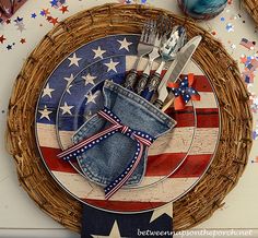 an american flag plate with utensils on it