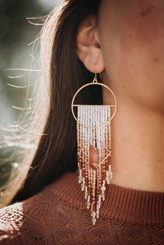 Beautiful, handmade seed bead earrings. Beads are hand-woven onto brass hoops, with a gold diamond and dyed quartz crystal hanging in front. Bohemian Crystal Earrings With Faceted Beads, Bohemian Gold Beaded Crystal Earrings, Fringe Earring, Crystal Hanging, Earrings Beads, Bead Fringe, Brass Hoops, Beaded Fringe, Seed Bead Earrings