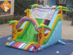 an inflatable bounce house with slide and blow up