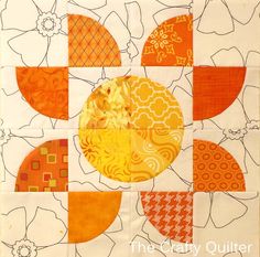 an orange, yellow and white quilt with flowers on it's side is featured in the center