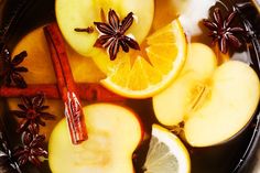 apples, cinnamons and star anise are in a bowl