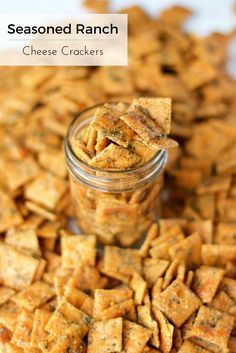 a jar filled with cheese crackers sitting on top of a table