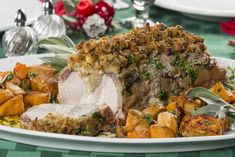 a white plate topped with meat covered in stuffing