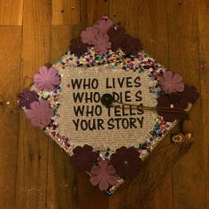 a decorated graduation cap with the words who lives who tells your story