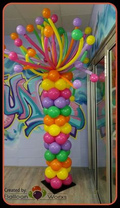 the balloon column is decorated with multicolored balloons