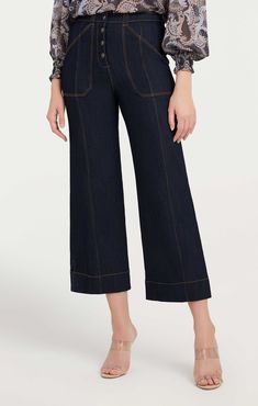 Indulge in the timeless classic, the Benji Pant. These wide-leg cropped denim jeans feature utilitarian patch pockets for a look that yours must-have. Essential for any wardrobe! Details Button flyFabric: Indigo DenimHigh risePatch pocket detail Cropped Content and Care 77% Cotton 21% Polyester 2% ElastaneDry Clean OnlyImported Measurements 26in/66.04cm, inseamMeasurements from size 4 Spring Flare Jeans With Patch Pockets In Dark Wash, Spring Dark Wash Flare Jeans With Patch Pockets, Casual Wide Leg Cropped Jeans With Patch Pockets, Fall Cropped Leg Jeans With Contrast Stitching, Fall Cropped Jeans With Contrast Stitching, Fall Cropped Jeans With Pockets, Casual Wide-leg Cropped Jeans For Work, Fall Cropped Flare Jeans With Pockets, Dark Wash Wide Leg Work Pants With Five Pockets