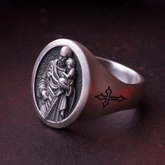 🎃Special Collection for Fall & Halloween Season!🎃 St Joseph Signet Ring⋆Mens Ring Sterling Sİlver⋆Holiday Gifts for Dad and Husband⋆Personalized Religious Ring⋆Handmade Christianity Jewelry Sterling Silver St Joseph Signet Ring is an exclusive piece that handmaded by Mars Jewelry Gifts. It is specially designed for a detailed engraving and eye-catching finish. Silver St Joseph Signet Ring will be an amazing and exciting gift for everybody. Order now with FREE SHIPPING and Personalization Optio Gothic Stainless Steel Ring As A Gift, Gothic Silver Ring As A Gift, Gothic Silver Rings For Gifting, Gothic Silver Rings For Gifts, Silver Gothic Rings For Gifts, Gothic Engraved Rings For Gift, Adjustable Nickel-free Signet Ring As Gift, Handmade Gothic Rings For Anniversary, Symbolic Antique Silver Signet Ring