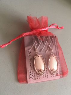 ♥*'¨) ¸.*¸.*'¸.**'¨) ¸. (¸.*' (¸.*` Two silver spoons made into a fun and beautiful pair of earrings. The pattern is called Remembrance 1948 by 1847 Rogers Bros.. The earrings are on a silver plated ear wire Measurements including ear wire: 4 cm x 2 cm x 1 cm What a great way to turn old silverware into a fun and functional piece of jewelry This item also comes with a reusable gift bag. WE TAKE SPECIAL ORDERS, EVEN WITH YOUR OLD SILVERWARE Reduce, Reuse Recycle! Thank you for checking out our sh Flatware Earrings, Silver Spoon Earrings, Nickel-free Silver Earrings With Recycled Glass, Reusable Gift Bags, Reuse Recycle, Spoon Jewelry, Silver Spoons, Gift Bag, Silver Plate