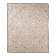 an image of a blanket with flowers on the front and back side, in light pink