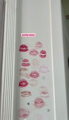 the lipstick on the door is pink and has a sticker that says pretty mess