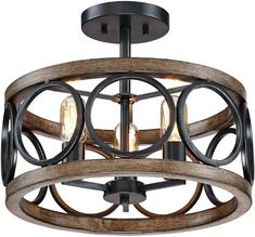 the light fixture is made out of wood and has an iron ring design on it