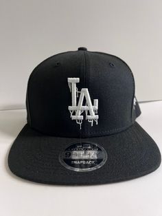 "-Drip \"LA\" (White thread) -New Era 9Fifty adjustable Snapback -color: Black" Cheap Gray Snapback Hat For Streetwear, Cheap Adjustable Black Snapback Hat, Fitted Caps, Los Angeles Dodgers, Trucker Cap, Snapback Hats, Valencia, New Era, Caps Hats