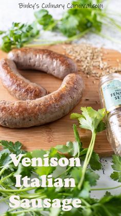 a sausage and some parsley on a cutting board with the words venison italian sausage