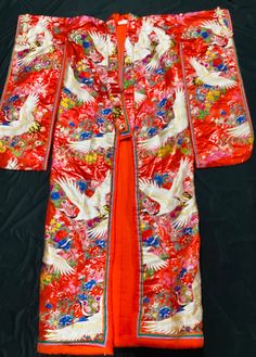 "Vintage 100% Silk Embroidered Japanese Wedding Ceremonial Kimono with stuffed hem, tassel detail and contrast facing. Excellent condition. Length measures approximately 78\" long. Small holes at bottom, likely from rubbing on floor surfaces. Otherwise great condition. Bright colors, it will look great as a wall hanging." Traditional Red Embroidered Kimono, Traditional Red Floral Print Kimono, High-end Red Kimono With Kimono Sleeves, Red Vintage Cotton Kimono, Japanese Kimono Red, Red Gold Wedding, Japanese Wedding, Wedding Kimono, Vintage Japanese Kimono