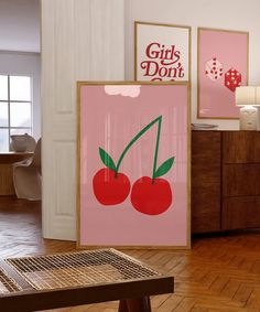 there are posters on the wall in this room, and one has two cherries