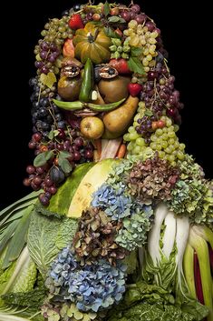 a woman made out of fruits and vegetables