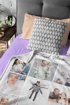 a bed covered in blankets and pillows with pictures on it's side, along with two pillow cases