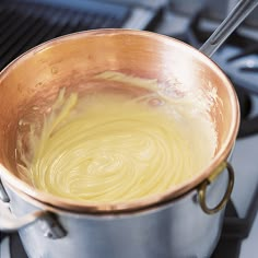 a saucepan is sitting on top of the stove