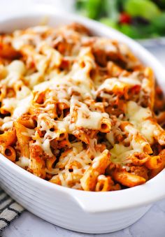 a casserole dish filled with pasta and cheese