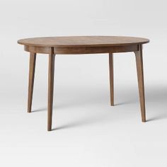 an oval wooden table with two legs and a circular top, on a white background