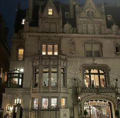 a large building with lots of windows at night