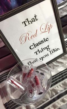 there is a sign on the table that says red lip classic thing that you like