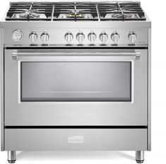 a white stove top oven with four burners and two doors on the front side