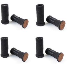 four black wooden posts are lined up in a row on a white surface, with the top one turned upside down