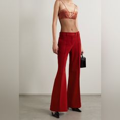 Acne Studios' Tailored From Red Twill That's Blended With Wool And A Hint Of Stretch For A Non-Restrictive Fit. They're Cut To Sit On The Waist And Have Flared Legs Traced With Elongating Center Seams Before Falling To Cuffed Hems. Elegant Red Flare Bottoms, Red Fitted Pants For Formal Occasions, Chic Red Bottoms For Party, Red Fitted Formal Pants, Red High Waist Evening Pants, Red High Waist Pants For Evening, High Waist Red Pants For Evening, Chic Red Pants For Party, Red Tailored Bottoms For Party