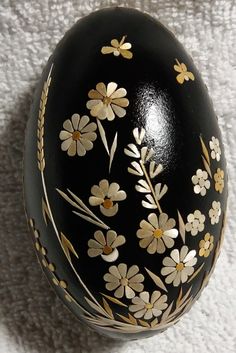 an egg with flowers painted on it