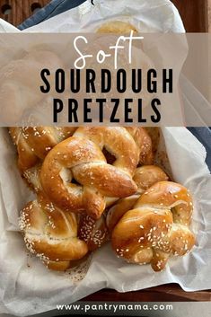 a basket filled with sourdough pretzels sitting on top of a table